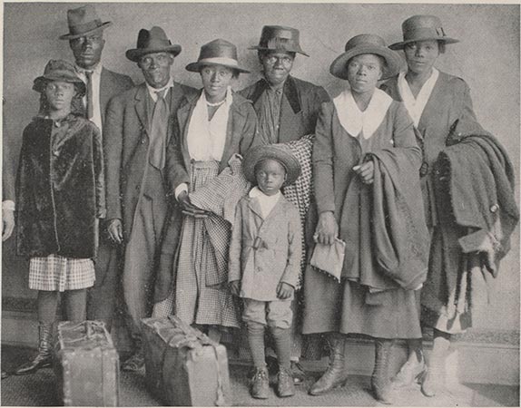 A black and white photograph of a Black family of eight