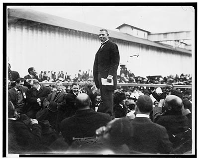 Black and white photograph of Booker T. Washington addressing a crowd at Mound Bayou