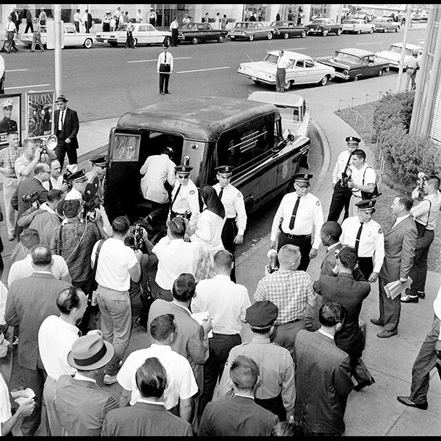 Freedom Riders being loaded into a police wagon
