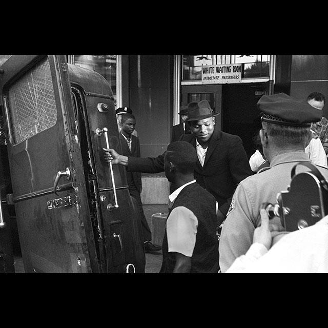 Freedom Riders loading into a police wagon after leaving a white waiting room