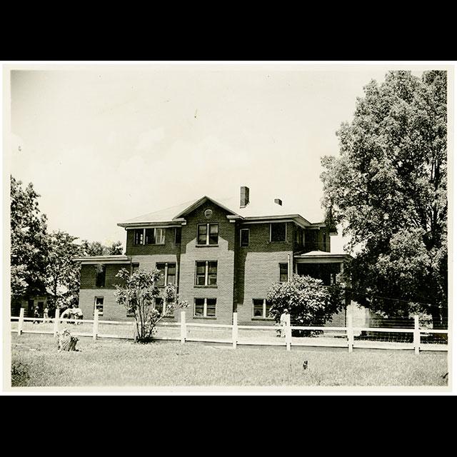 A black and white photograph of the home of Isaiah T. Montgomery