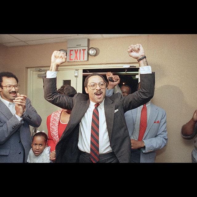 A color photograph of Mike Espy celebrating his win as the first Black Mississippian to be elected to the US House of Representatives on November 4, 1986