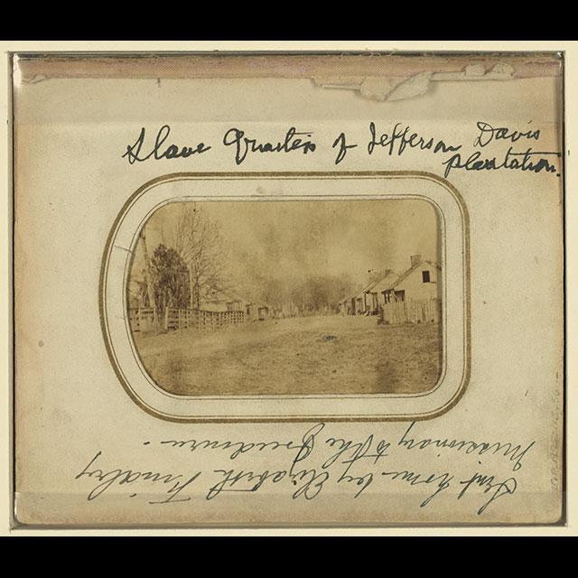 A black and white photograph of the slave quarters of Jefferson Davis’ plantation, Brierfield