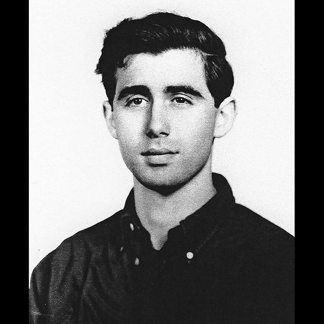 A black and white photograph of Andrew Goodman